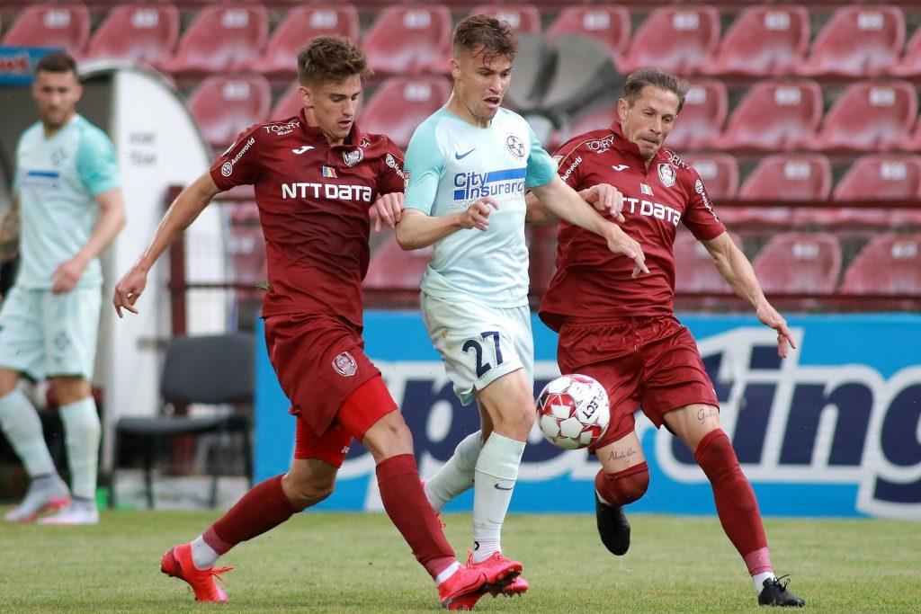 CLUJ-NAPOCA, ROMANIA – JUNE 14: Darius Olaru of FCSB with Cristian Itu and Ciprian Deac of CFR Cluj during the match between CFR Cluj and FCSB in the play-off of Romanias First League on June 14, 2020 in Cluj-Napoca, Romania. (Photo by Paul Ursachi/MB Med