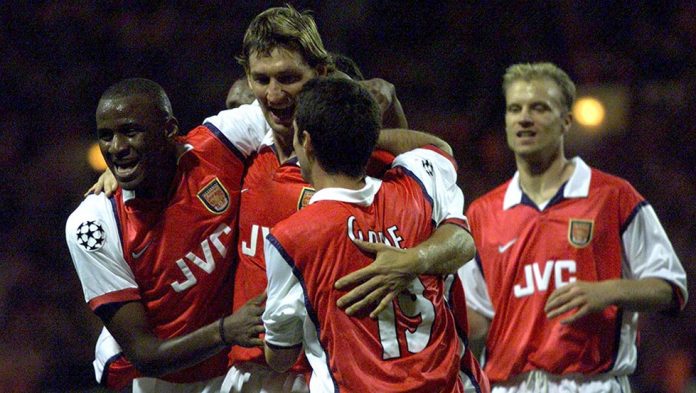 ARSENAL'S TONY ADAMS CELEBRATES HIS GOAL.